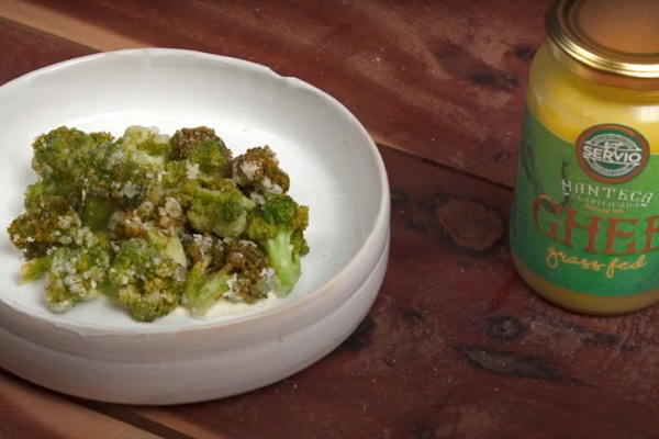 Broccoli cooked in ghee served with spiced sour cream